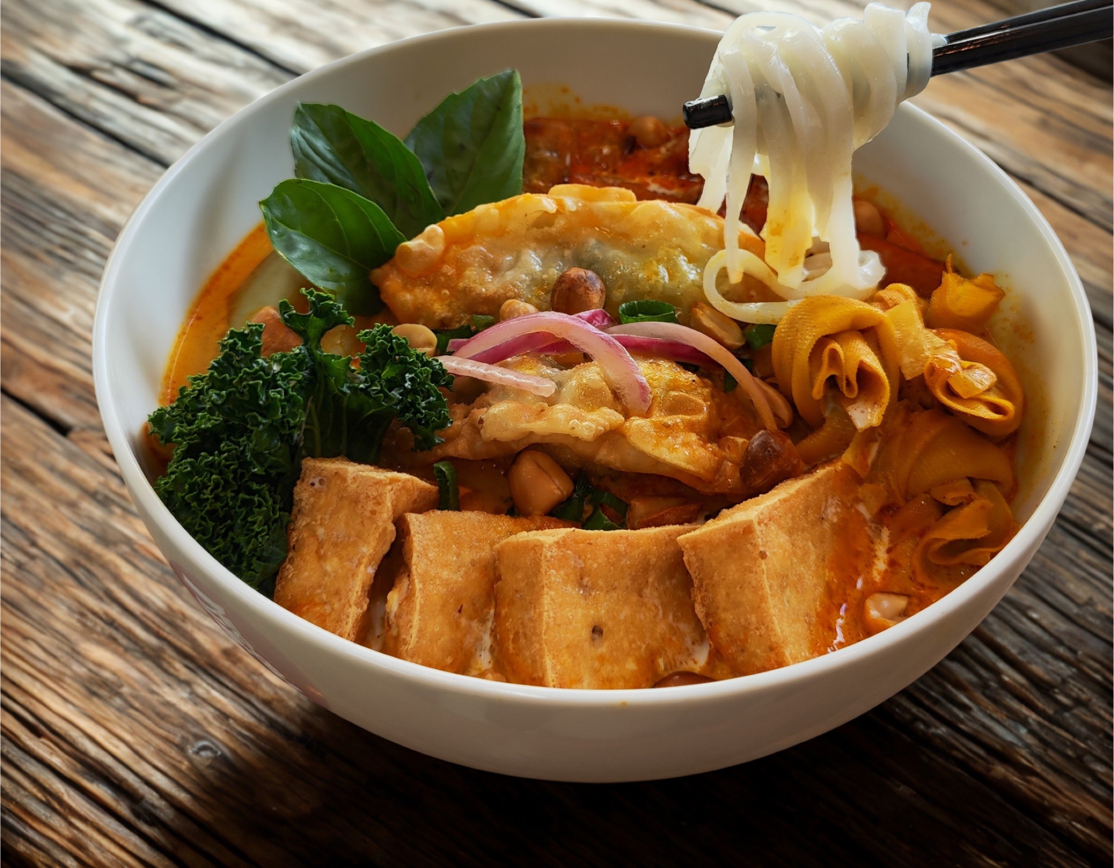 VieVegan creamy coconut curry phở with tofu and fresh herbs